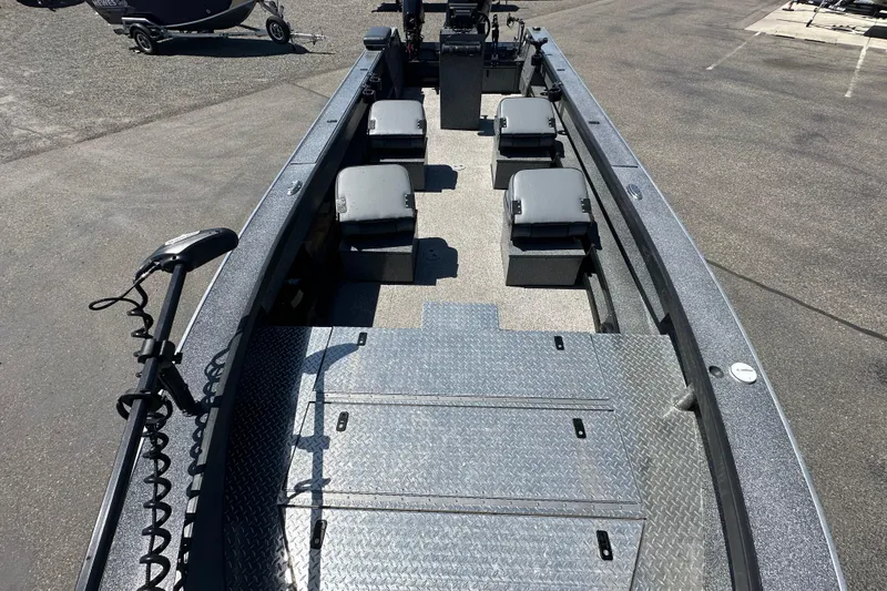 Slide: The Image of 2024 Alumaweld Columbia 25 boat interior with seating and storage compartments. - 13