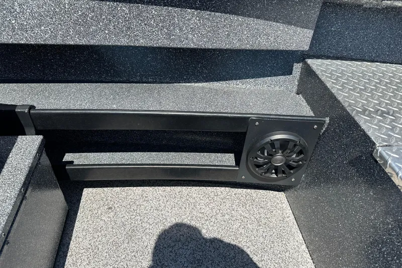 Slide: The Image of 2024 Alumaweld Columbia 25 boat interior with speaker and textured flooring. - 15