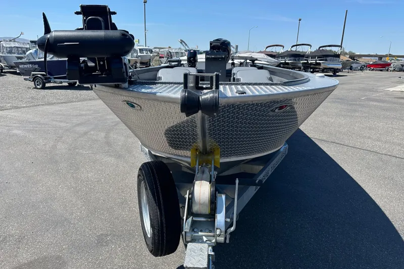 Slide: The Image of 2024 Alumaweld Columbia 25 boat on trailer, parked in a marina lot. - 3
