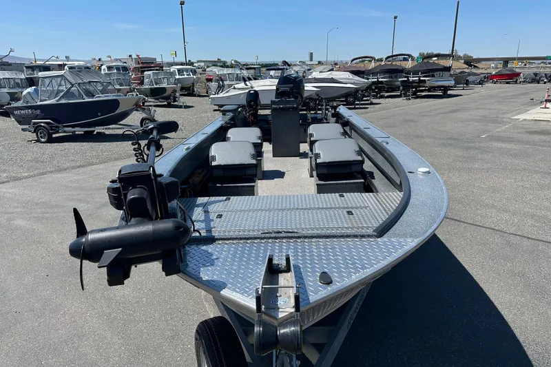 Slide: The Image of 2024 Alumaweld Columbia 25 boat in a marina, showcasing sleek design and spacious interior. - 4