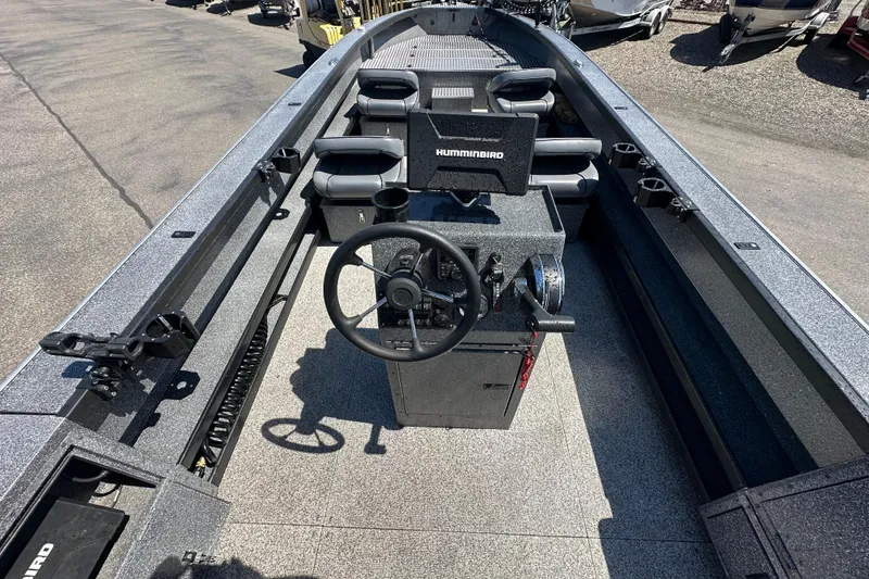 Slide: The Image of 2024 Alumaweld Columbia 25 boat interior with steering console and seating. - 7