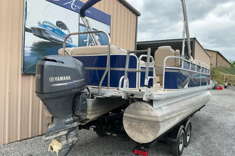 Slide: The Image of 2012 Godfrey Sweetwater 2486 C pontoon boat with Yamaha outboard motor on trailer. - 2