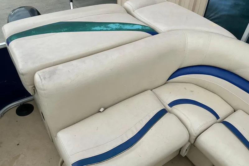 Slide: The Image of 2012 Godfrey Sweetwater 2486 C boat seating with blue and green accents. - 7