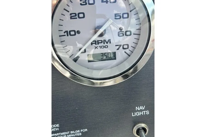 Slide: The Image of Close-up of a 2008 Sea Ray 185 Bow Rider RPM gauge showing 3500 RPM. - 10