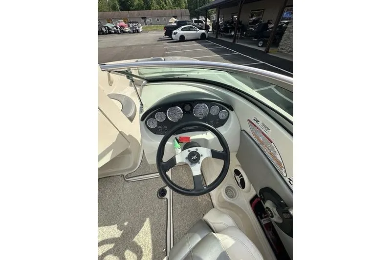 Slide: The Image of 2008 Sea Ray 185 Bow Rider dashboard with steering wheel and instrument panel. - 12