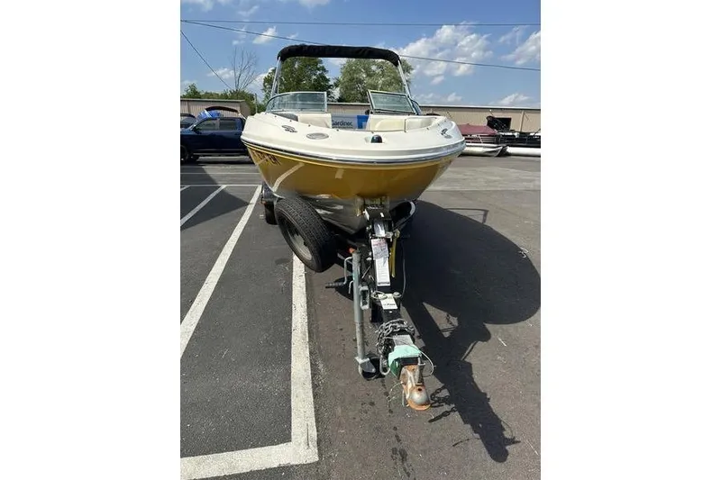 Slide: The Image of 2008 Sea Ray 185 Bow Rider boat on trailer, parked outdoors. - 15