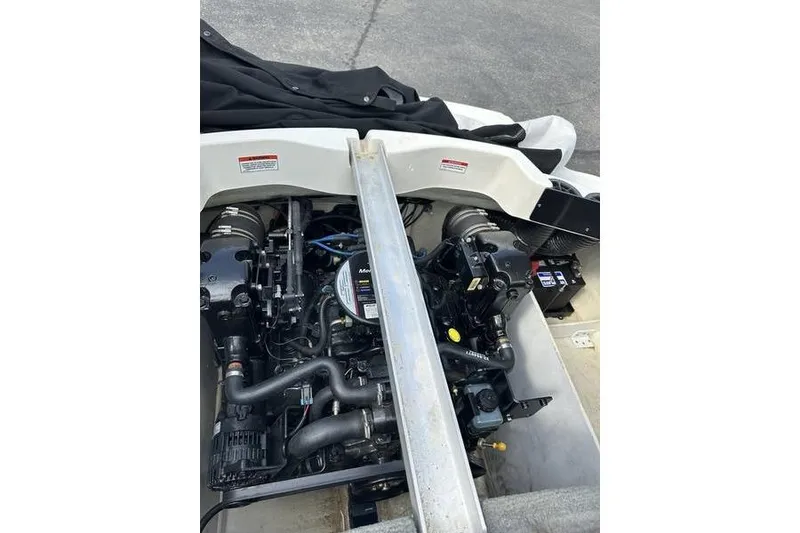 Slide: The Image of Engine compartment of a 2008 Sea Ray 185 Bow Rider boat, showcasing mechanical components. - 3