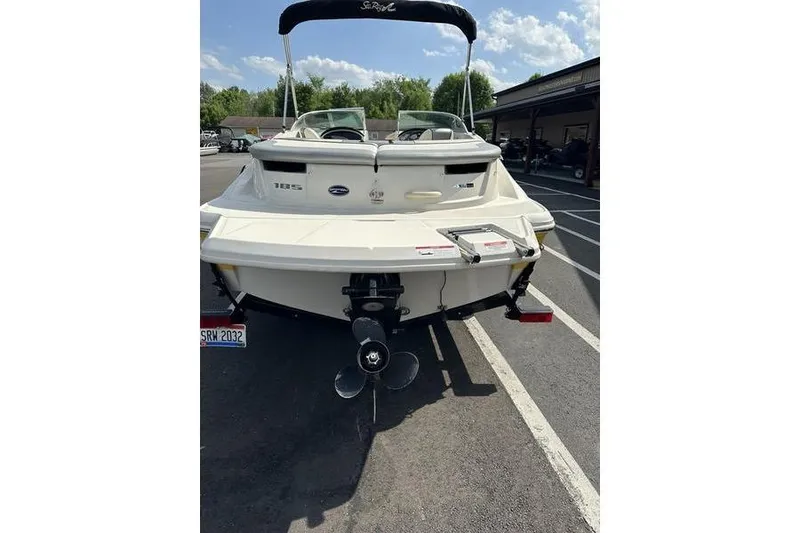Slide: The Image of 2008 Sea Ray 185 Bow Rider boat, rear view, parked outdoors on a sunny day. - 7