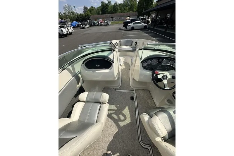 Slide: The Image of 2008 Sea Ray 185 Bow Rider interior with dual seating and dashboard view. - 8