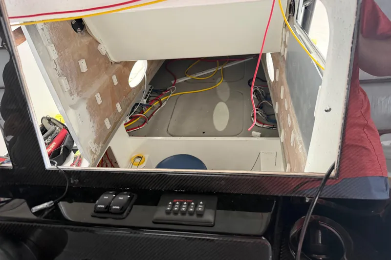 Slide: The Image of Interior view of a 2027 Nor-Tech 390 Sport Center Console boat under construction. - 13