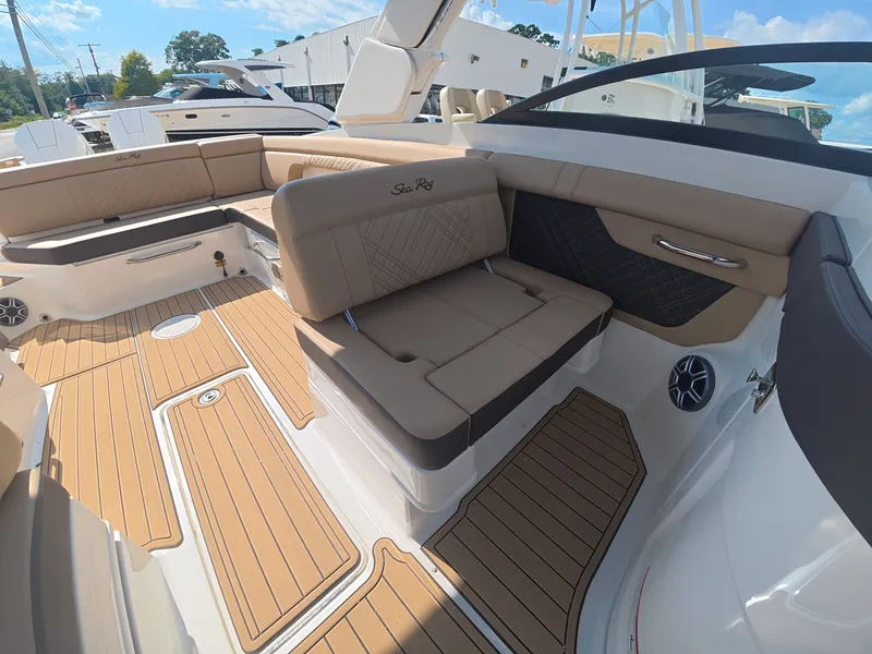 Slide: The Image of Interior of a Sea Ray SDX 290 Outboard with sleek seating and wood flooring. - 15