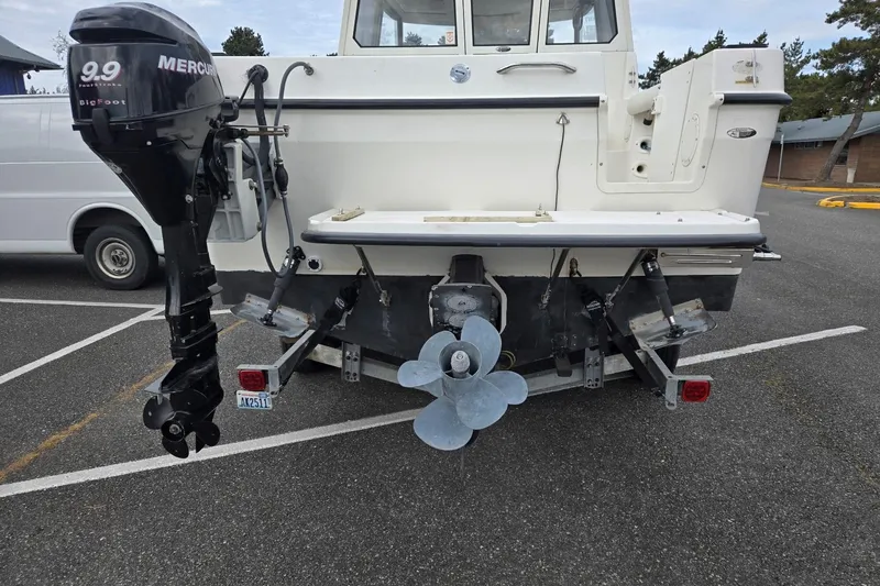 Slide: The Image of Rear view of a 2006 Trophy 2359 Pro boat with Mercury outboard motor. - 10