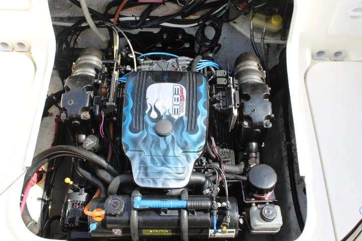Slide: The Image of Engine compartment of a 2006 Trophy 2359 Pro boat, featuring a powerful 383 engine. - 18