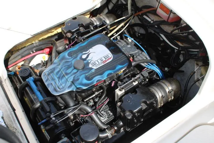 Slide: The Image of Engine compartment of a 2006 Trophy 2359 Pro boat, featuring a 383 Mag engine. - 19