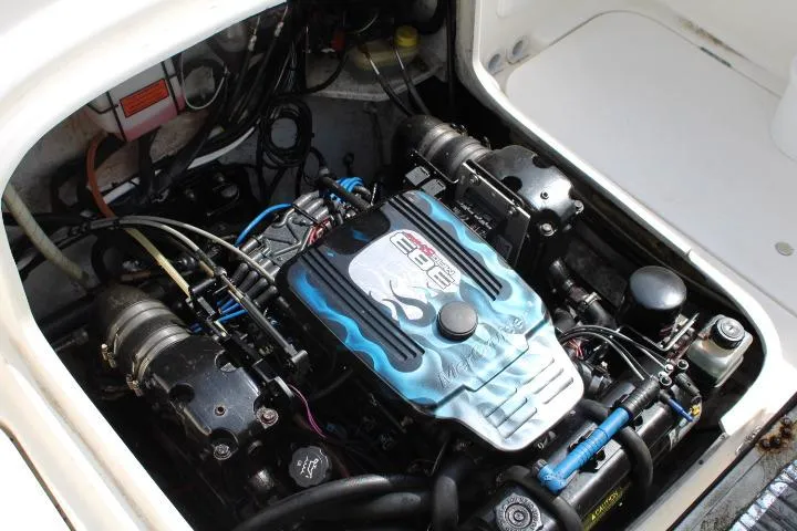 Slide: The Image of Engine compartment of a 2006 Trophy 2359 Pro boat, showcasing detailed mechanical components. - 20