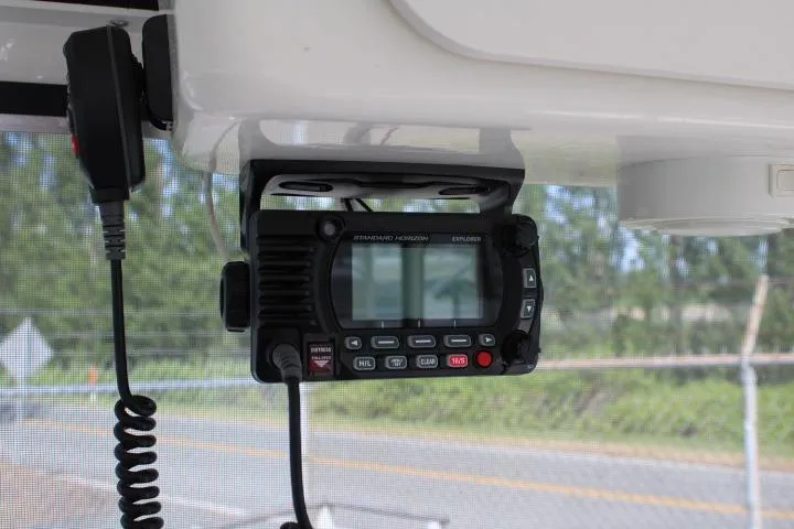 Slide: The Image of Marine radio installed on a 2006 Trophy 2359 Pro boat dashboard. - 27