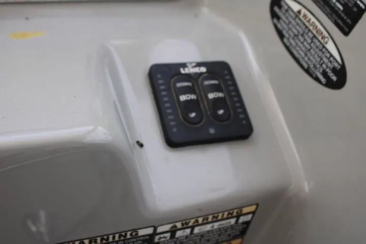 Slide: The Image of Control panel on 2006 Trophy 2359 Pro boat with warning labels. - 29