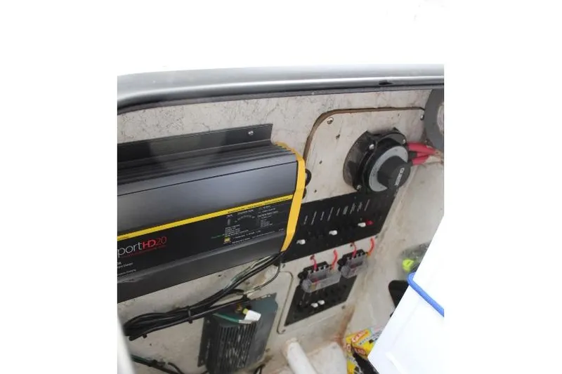 Slide: The Image of Electrical panel of a 2006 Trophy 2359 Pro boat, featuring wiring and components. - 31