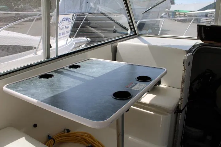 Slide: The Image of Interior of 2006 Trophy 2359 Pro boat with table and cup holders. - 35
