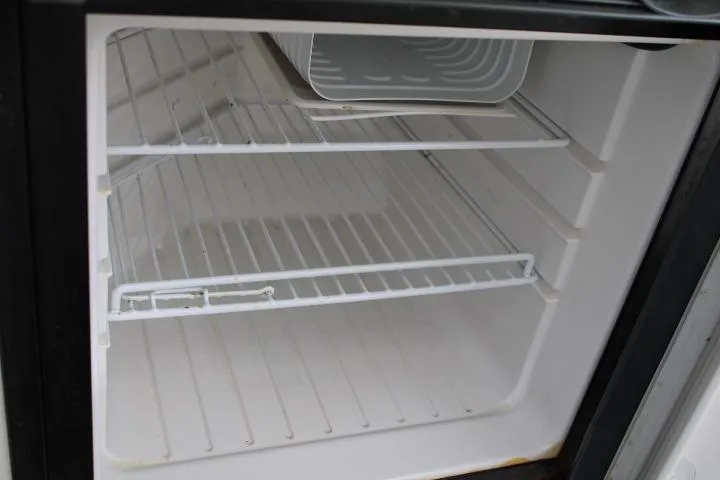 Slide: The Image of Empty refrigerator interior with wire shelves, Trophy 2359 Pro model, 2006. - 38