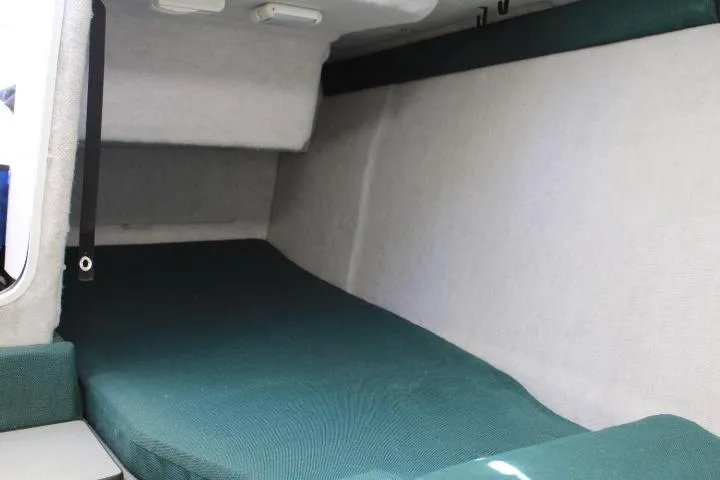 Slide: The Image of Interior cabin of 2006 Trophy 2359 Pro boat with green upholstery. - 40
