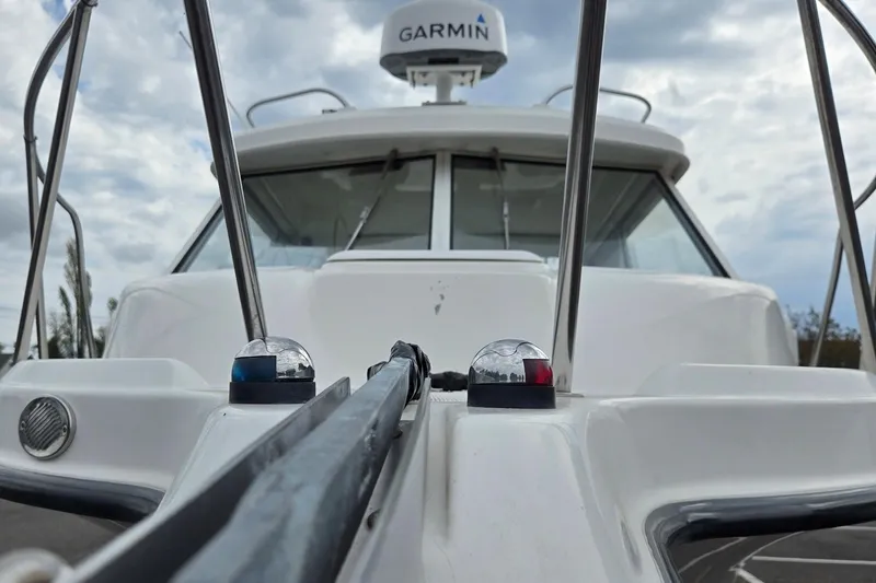 Slide: The Image of 2006 Trophy 2359 Pro boat with Garmin radar, viewed from the bow under cloudy skies. - 5