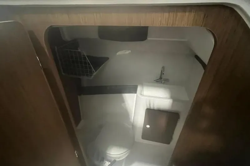 Slide: The Image of 2022 Jeanneau NC 795 boat interior bathroom with toilet and sink. - 5