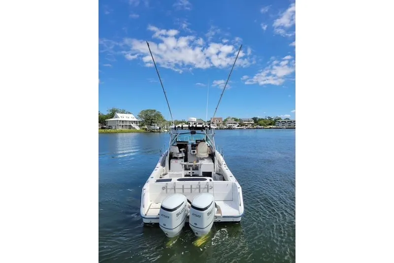 Slide: The Image of 1989 Grady-White Marlin 280 boat with dual engines on a sunny day. - 3