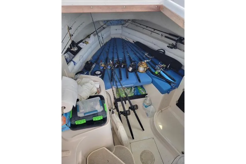 Slide: The Image of Interior of a 1989 Grady-White Marlin 280 boat with fishing rods and gear. - 5