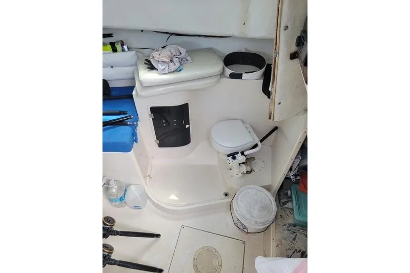 Slide: The Image of 1989 Grady-White Marlin 280 boat interior with toilet and storage area. - 6