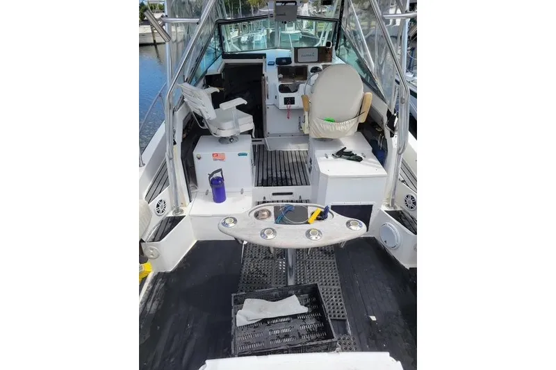Slide: The Image of 1989 Grady-White Marlin 280 boat interior with seating and fishing equipment. - 8