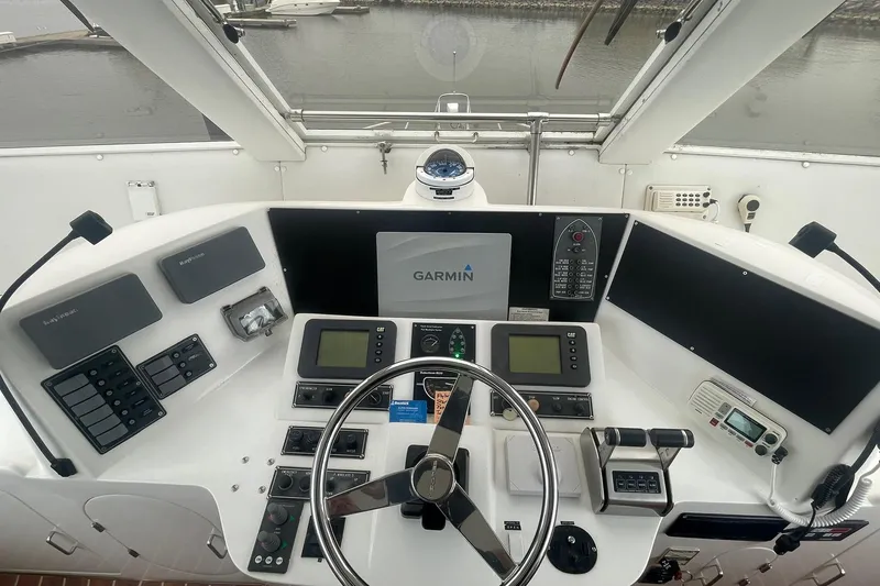 Slide: The Image of Cockpit of 2001 Novatec Islander yacht with Garmin navigation system and control panels. - 11