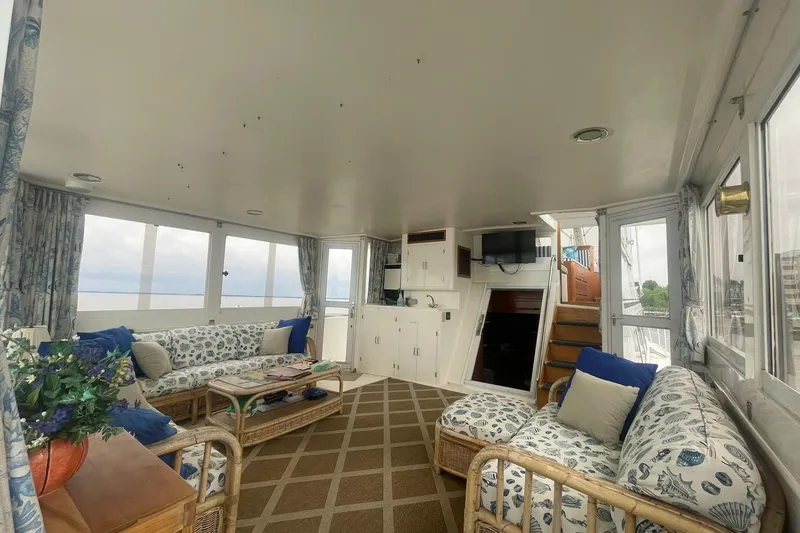 Slide: The Image of Spacious interior of 2001 Novatec Islander yacht with comfortable seating and nautical decor. - 14