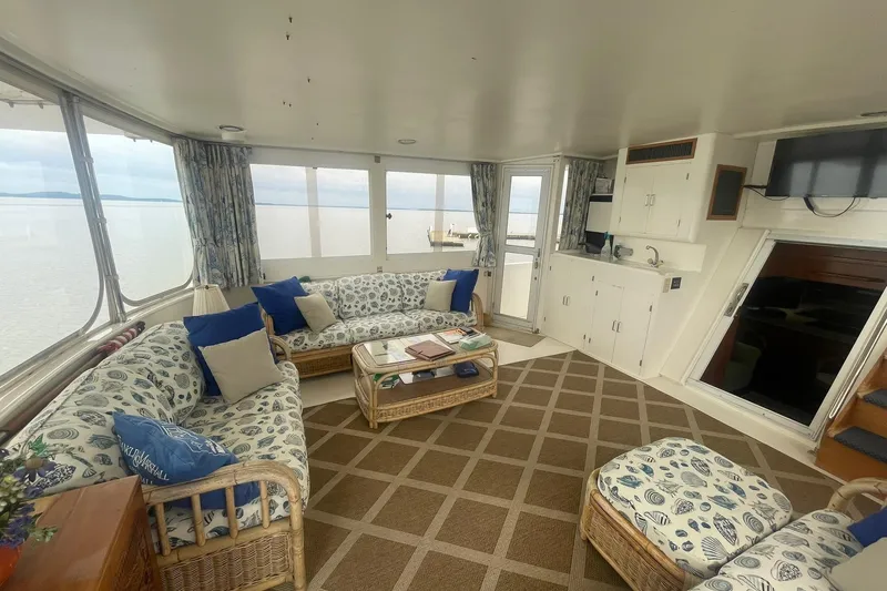 Slide: The Image of Spacious interior of 2001 Novatec Islander yacht with cozy seating and panoramic windows. - 15