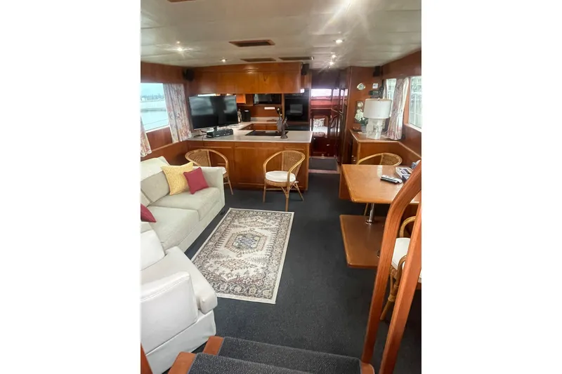 Slide: The Image of Luxurious 2001 Novatec Islander yacht interior with cozy seating, dining area, and modern amenities. - 19