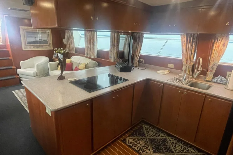 Slide: The Image of Luxurious 2001 Novatec Islander yacht interior with modern kitchen and cozy seating area. - 24