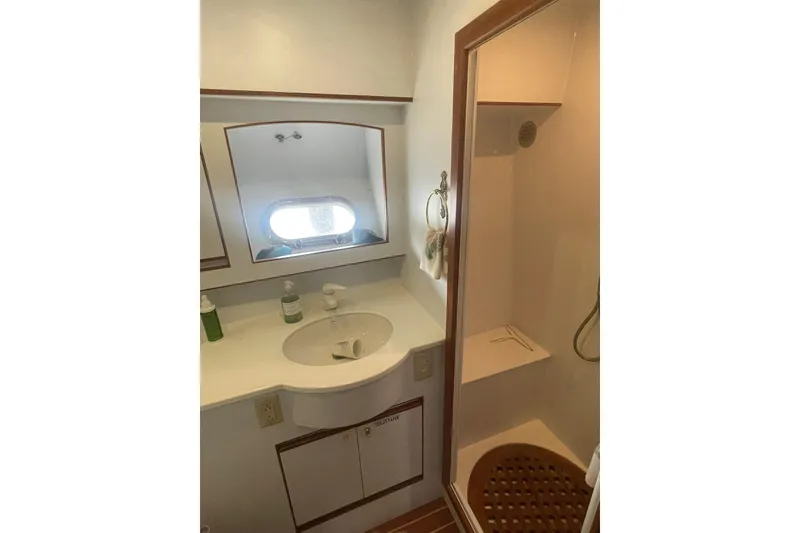 Slide: The Image of 2001 Novatec Islander yacht bathroom with sink, mirror, and shower. - 31