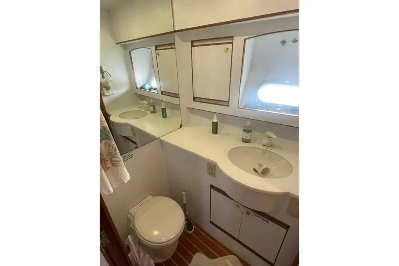Slide: The Image of Bathroom interior of 2001 Novatec Islander yacht with sink, mirror, and toilet. - 32