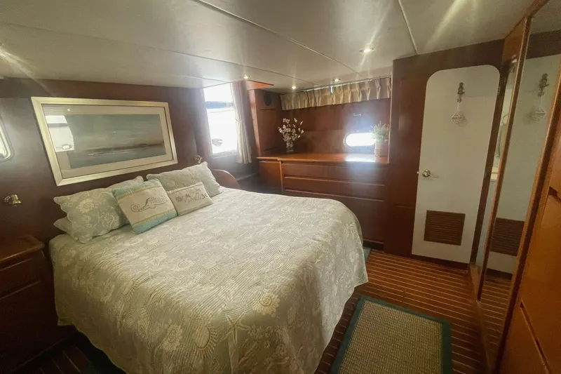 Slide: The Image of Luxurious 2001 Novatec Islander yacht bedroom with elegant wood paneling and cozy bedding. - 38
