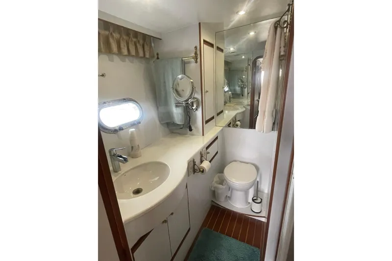 Slide: The Image of Bathroom interior of 2001 Novatec Islander yacht, featuring sink, toilet, and mirror. - 41