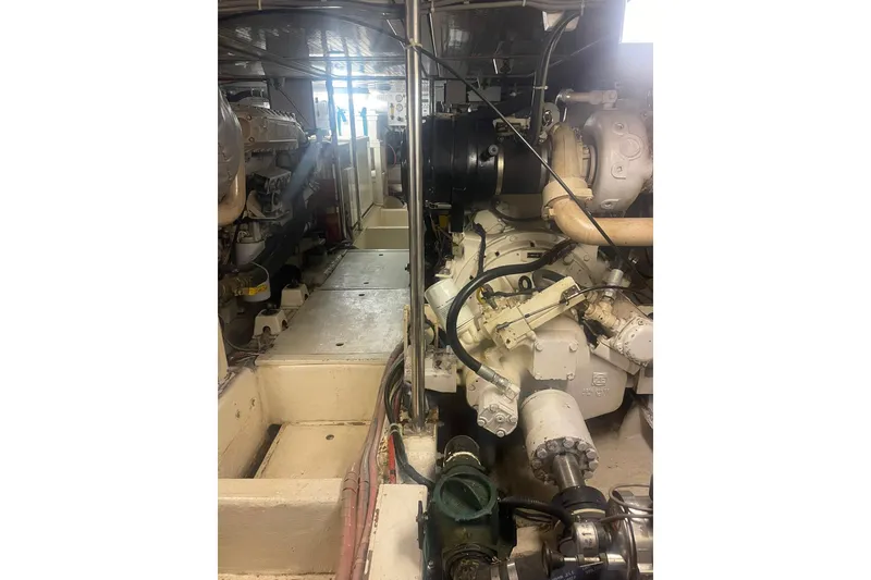 Slide: The Image of Engine room of a 2001 Novatec Islander yacht, showcasing mechanical components and layout. - 44