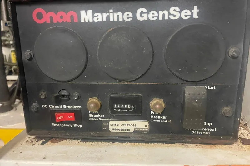 Slide: The Image of Onan Marine GenSet control panel on a 2001 Novatec Islander boat. - 50