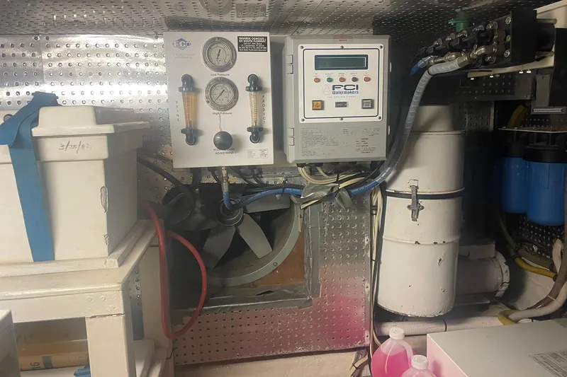Slide: The Image of Engine room of a 2001 Novatec Islander with control panels and equipment. - 51