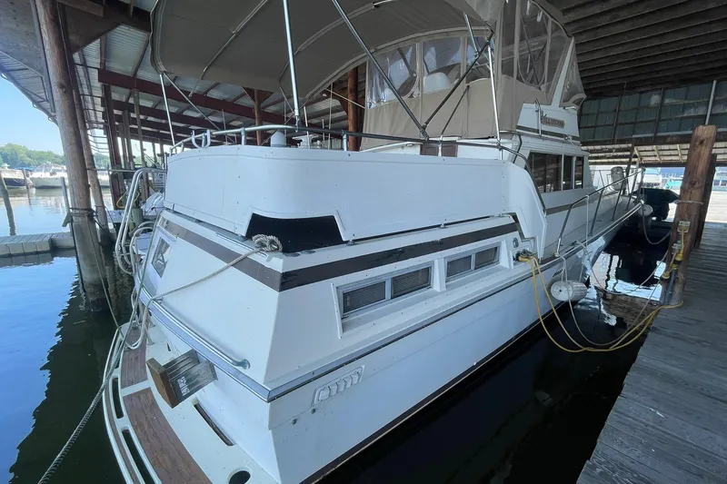 Slide: The Image of 2001 Novatec Islander yacht docked in a covered marina slip. - 56