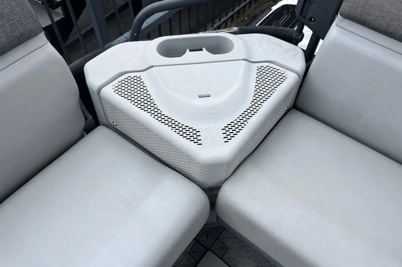 Slide: The Image of Interior seating of 2022 Sea-Doo Switch Cruise 21 with integrated storage and cup holder. - 7
