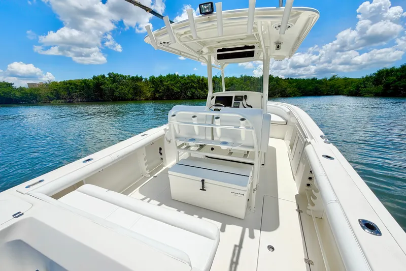 Slide: The Image of 2007 Edgewater 268CC boat on calm water under a clear blue sky. - 11