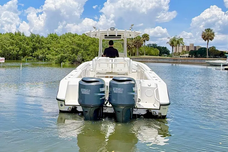 Slide: The Image of 2007 Edgewater 268CC boat with dual Yamaha engines on a sunny day. - 3