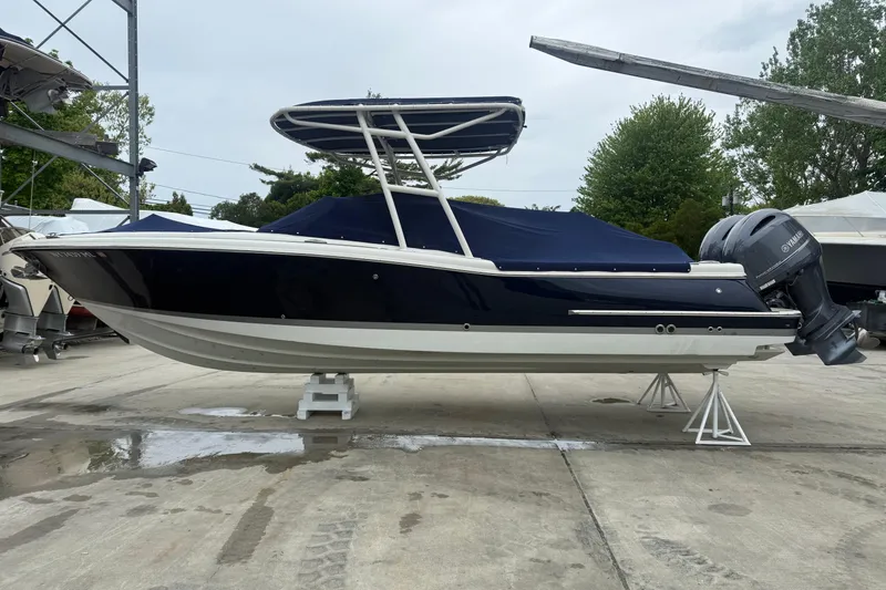 The Image of 2017 Chris-Craft Calypso 26 boat with Yamaha outboard, docked on a concrete surface. - 0