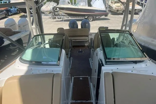 Slide: The Image of 2017 Chris-Craft Calypso 26 boat interior with dual consoles and seating. - 14