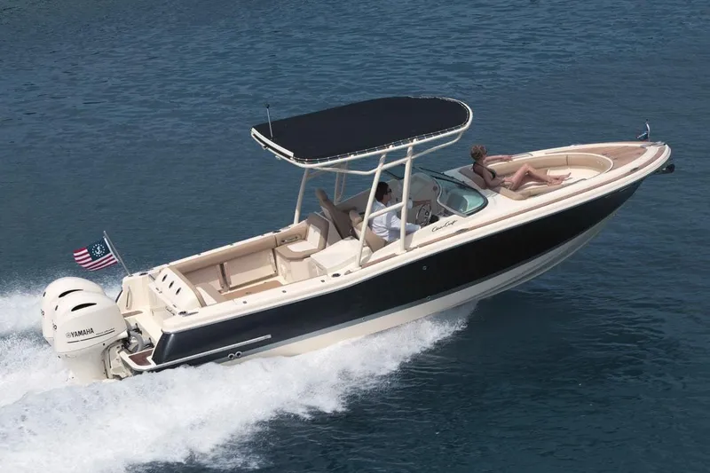 Slide: The Image of Manufacturer Provided Image: 2017 Chris-Craft Calypso 26 boat cruising on water with passengers. - 15